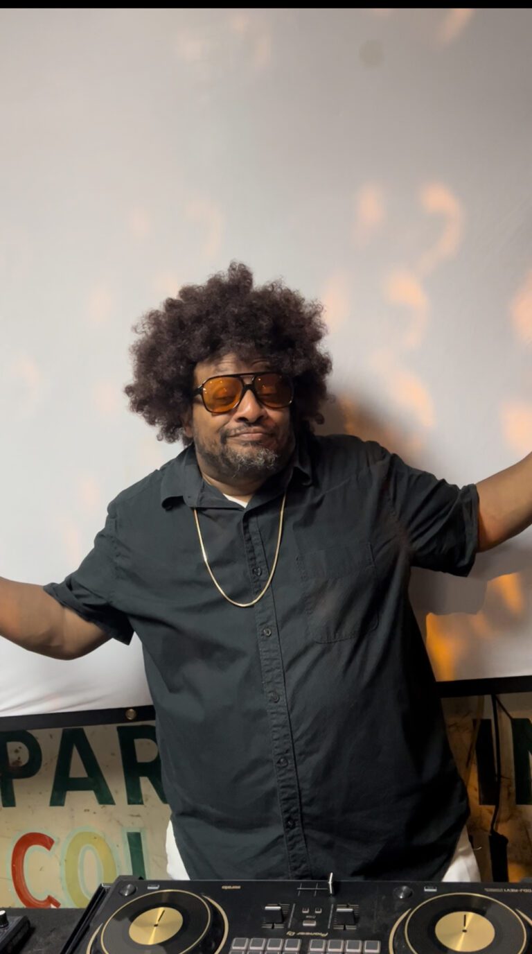 Man wearing a black shirt while being a dj