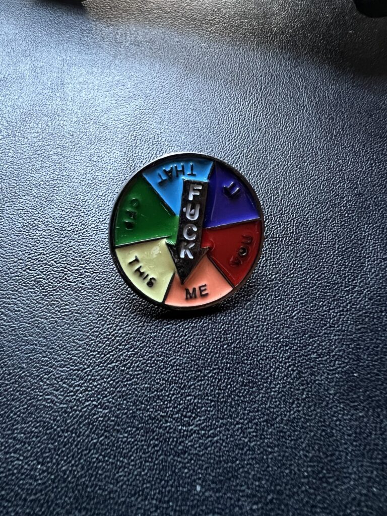 Colorful pin with an arrow